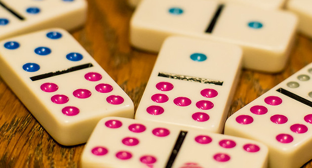When should you use hyphens in numbers? 2 Dominoes with blue and pink dots.