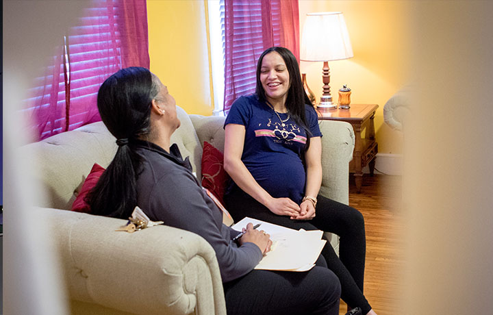 photo of a Family First Health community health worker visiting a patient at home